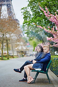 Romantic couple in Paris near the Eiffel tower