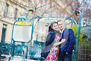 Romantic couple in Paris near metro station