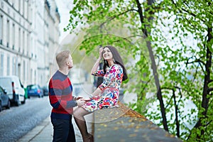 Romantic couple in Paris near the Seine