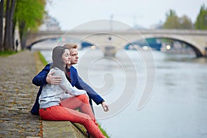 Romantic couple in Paris near the Seine