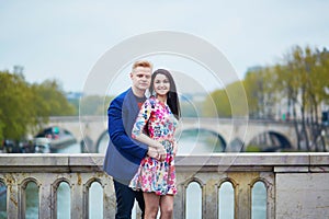 Romantic couple in Paris near the Seine