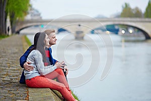 Romantic couple in Paris near the Seine