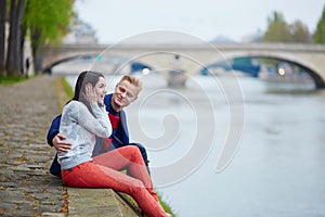 Romantic couple in Paris near the Seine