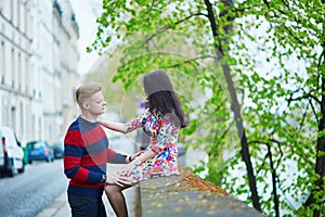 Romantic couple in Paris near the Seine