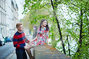 Romantic couple in Paris near the Seine