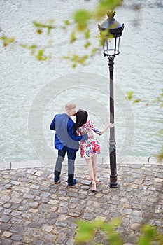 Romantic couple in Paris near the Seine