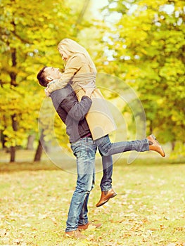 Romantic couple playing in the autumn park