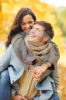 Romantic couple playing in the autumn park