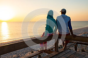 Romantic couple relaxes on a bungalow veranda