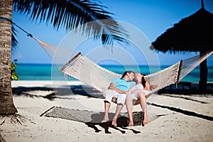 Romantic couple relaxing in hammock