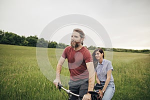 Romantic couple riding bicycle together