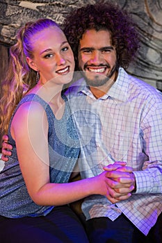 Romantic couple sitting together in bar