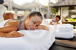 Romantic Couple Spa. People Relaxing, Enjoying Massage Outdoors