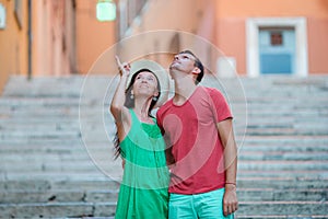 Romantic couple on Steps in Rome enjoy italian holidays. Happy lovers walking on the travel landmark tourist attraction