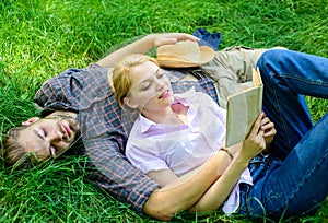 Romantic couple students enjoy leisure with poetry or literature grass background. Couple soulmates at romantic date