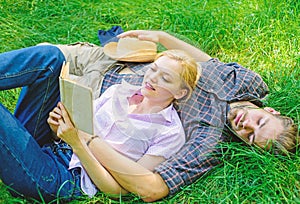 Romantic couple students enjoy leisure with poetry or literature grass background. Couple soulmates at romantic date