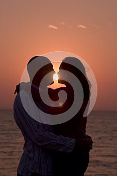 Romantic couple at sunset photo