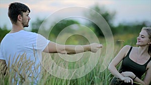 Romantic couple at sunset. Two people in love at sunset or sunrise. Man and woman have a good time together