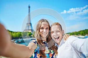 Romantic couple taking selfie in Paris