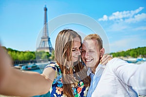 Romantic couple taking selfie in Paris