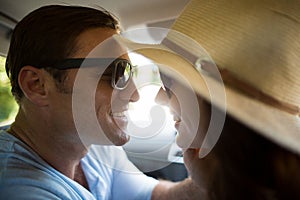 Romantic couple traveling in car