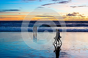 Romantic couple walk beach Bali