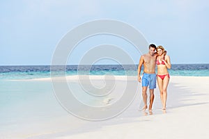 Romantic Couple Walking On Beautiful Tropical Beach