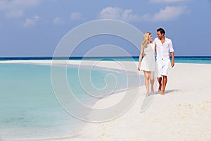 Romantic Couple Walking On Beautiful Tropical Beach