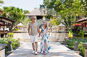 Romantic couple walking in tropical resort