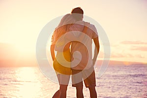 Romantic Couple Watching the Sunset on Tropical Beach