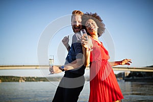 Romantic happy couples dancing and drinking at party