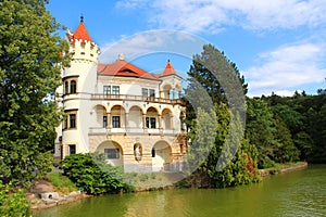 Romantic Czech castle reflected in the water