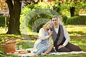 Romantic date. Celebrate love. Vintage style. Couple in love enjoying picnic time and food outdoors. Beautiful people in