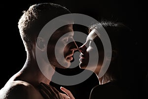 Romantic date. Closeup face of a beautiful young couple in love embracing, romance and and affection.