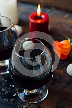 Romantic dinner drink - wine or brendy in glass.