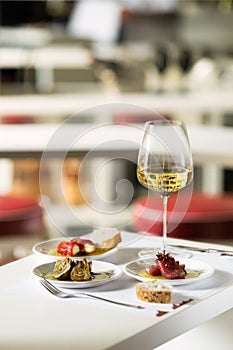 Romantic dinner, food and a glass of wine. Photograph of food on the table