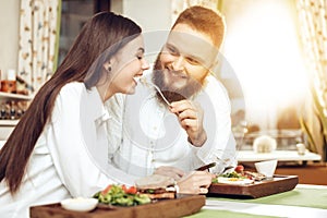 Romantic dinner happy men and women in restaurant