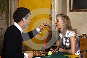 Romantic dinner in pizzeria photo