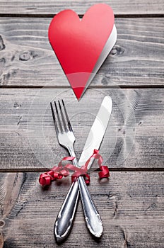 Romantic dinner set on wooden background