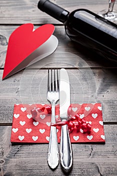 Romantic dinner set on wooden background