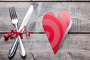 Romantic dinner set on wooden background