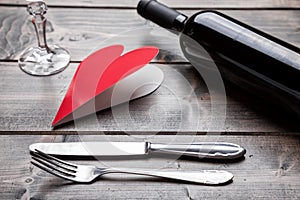 Romantic dinner set on wooden background