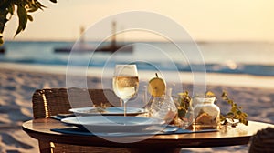 Romantic dinner setting on the beach at sunset