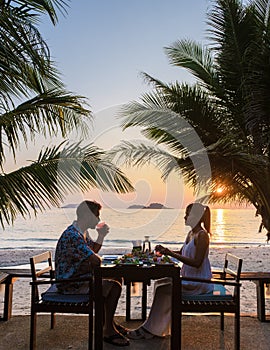 Romantic dinner during sunset on a tropical beach in Thailand, Koh Chang island