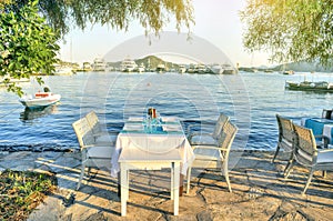 Romantic dinner table by the beach, Outdoor table of a beach restaurant in Gocek Turkey