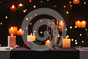 Romantic dinner table setting with burning candles