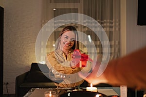 Romantic dinner for two, man in love giving gift to girlfriend for february 14, date or valentine& x27;s day, surprise for