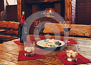 Romantic dinner for two near fireplace