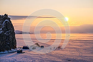 Romantic Evening twilight at frozen lake Baikal.