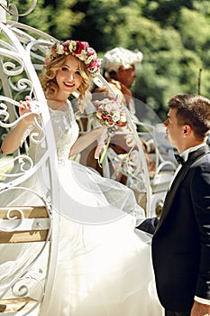 Romantic fairy-tale wedding couple bride and groom posing in mag